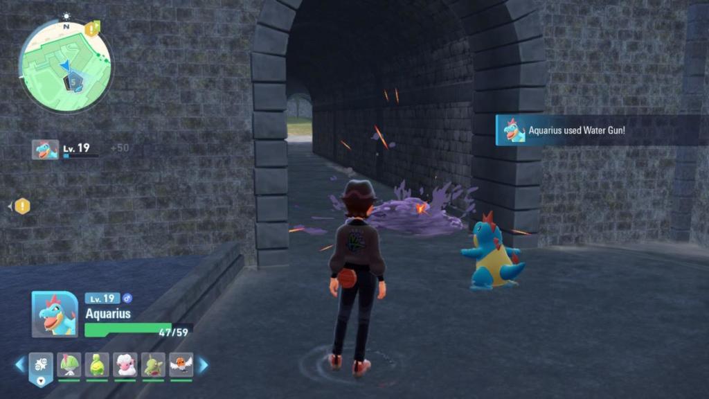 The Pokemon Crocanaw using a Water-type move to clean purple sludge in Pokemon Legends: ZA.