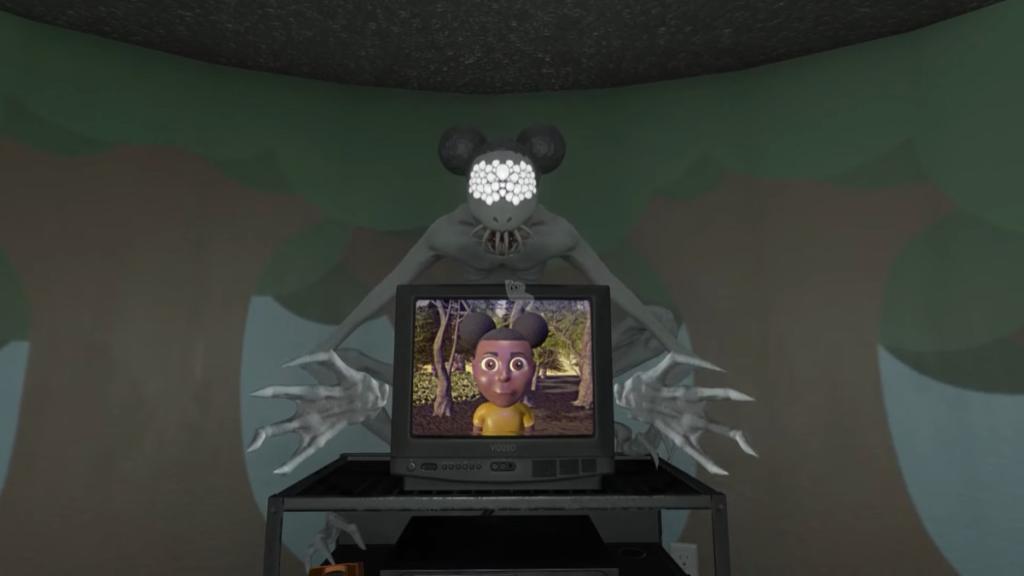 Colton Anomaly standing over treasure hunt playing on the tv as Amanda waits for a toy to be given to her