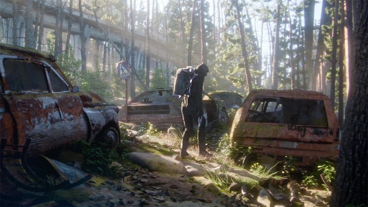 A character exploring car wrecks in ARC Raiders.