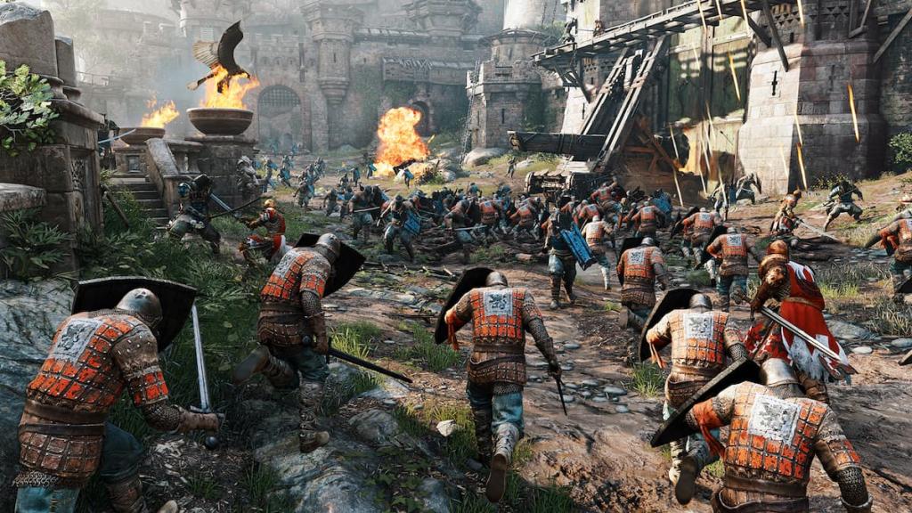 A bunch of smaller characters running into battle in For Honor. 