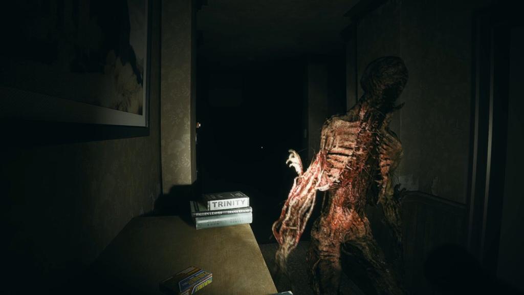 Close up of the mother with many teeth and a gaping mouth that curves round the ribcage