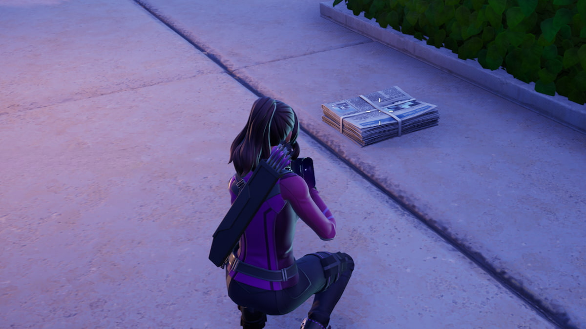 Kneeling and looking at a newspaper in fortnite