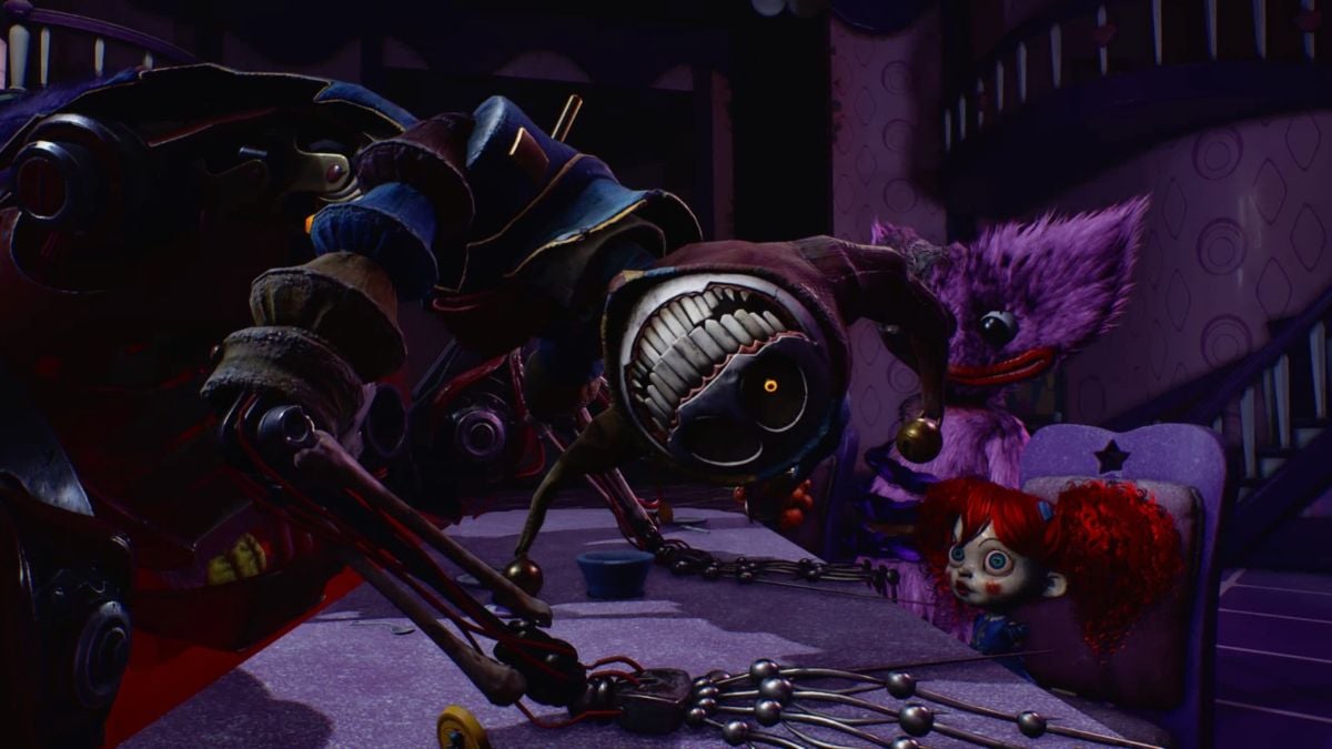 Prototype hanging his head, looking directly at camera, with Poppy and Kissy Missy seated opposite him