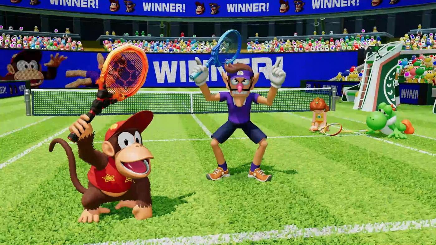 Diddy Kong and Waluigi stand in victorious poses as Daisy and Yoshi slouch on the ground defeated.
