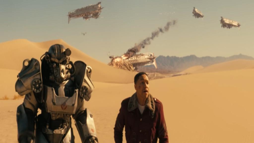 Maximus and Thaddeus running in desert with aircrafts doing down behind them