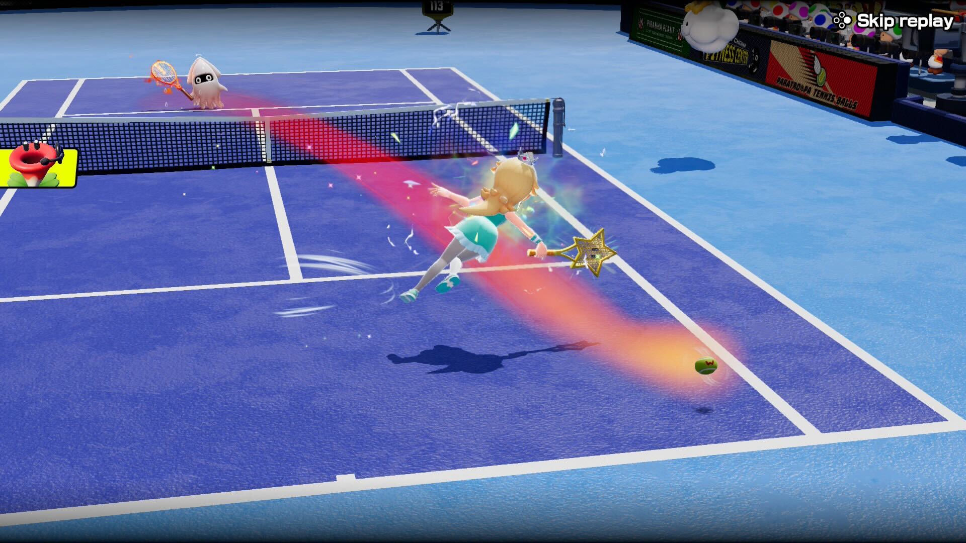 Rosalina dives towards a ball on a tennis court with a star-shaped tennis racket.