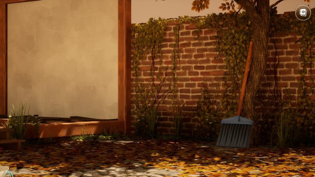 Broom and autumn leaves in hozy