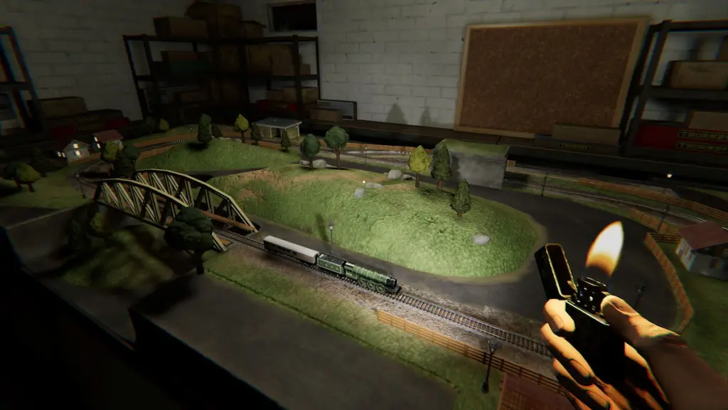 Holding a lighter and standing by a train set in basement in phasmophobia
