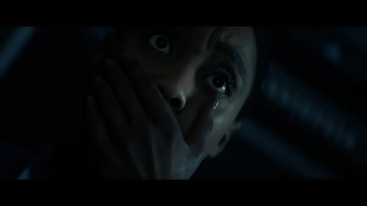 Young covering her mouth and holding her breath