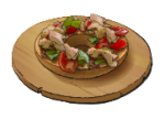 A circular wooden plate with a bowl on top full of salad