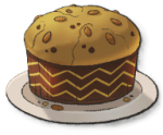 A giant load of bread with chunks of dried fruit and squiggly layers