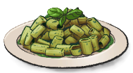 A plate of green noodles with herbs on top