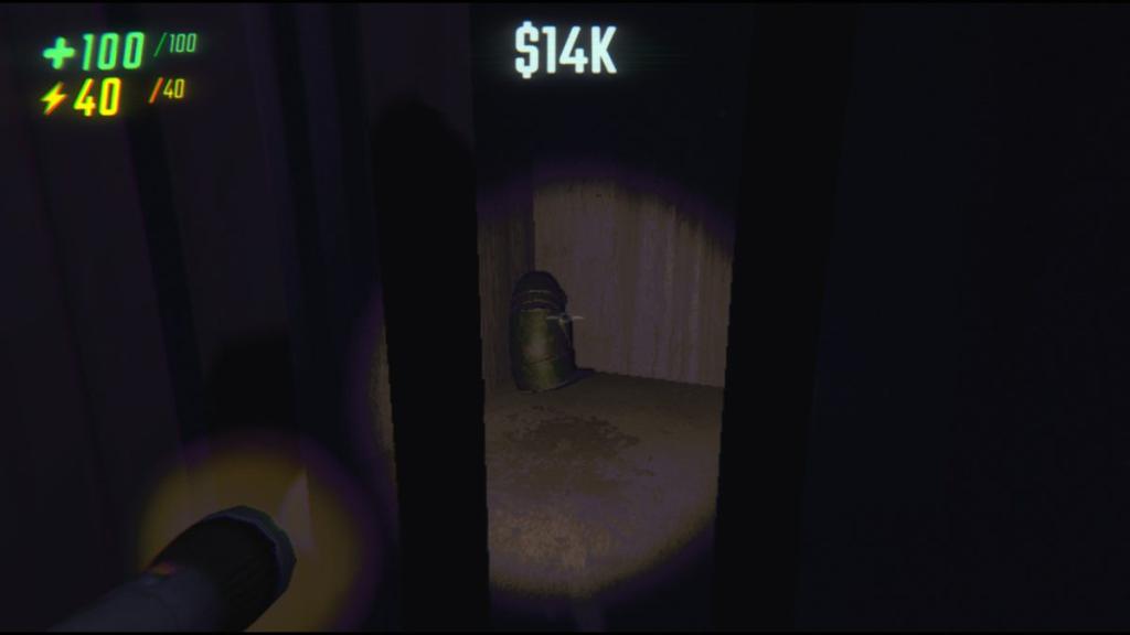 A semibot in the corner of a cage underneath a service station