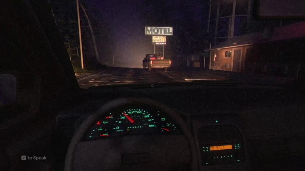 Driving in F2F Scratch Creek with truck and motel sign up ahead