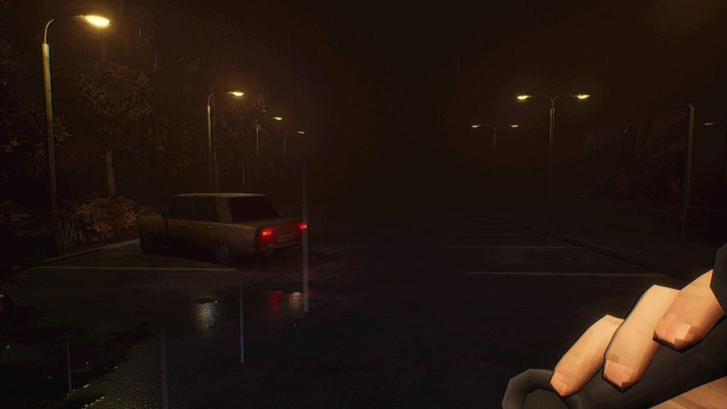 Rainy carpark with one parked car