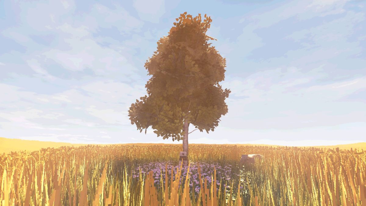 A single tree in the middle of a meadow and a grave beneath it