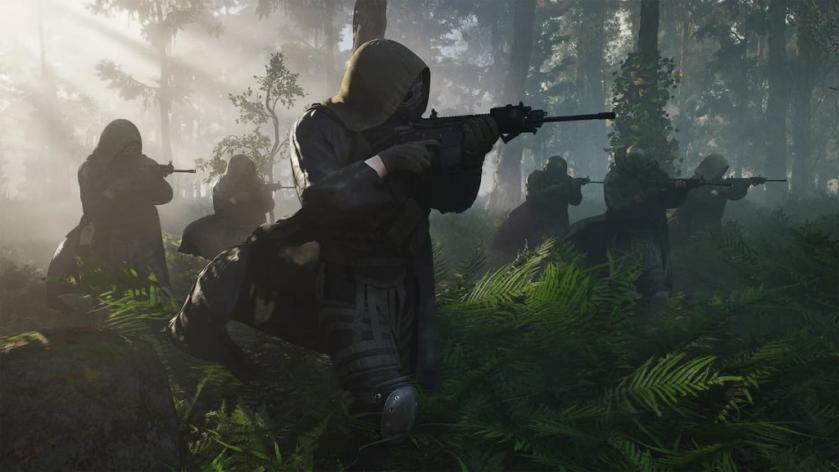 Soldiers walking through a forest in Ghost Recon Breakpoint.