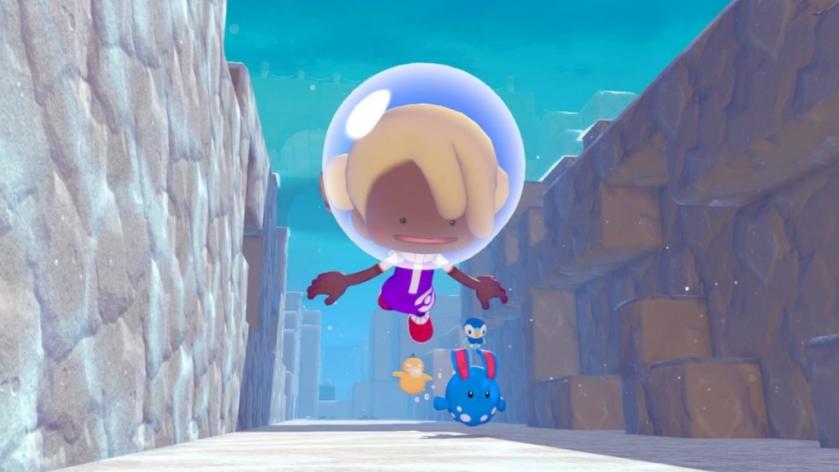 A player swimming underwater with pokemon in pokopia