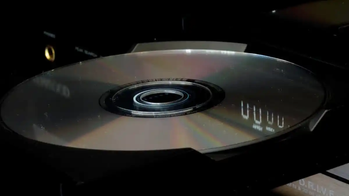 A picture of a CD disc in a CD/DVD drive.