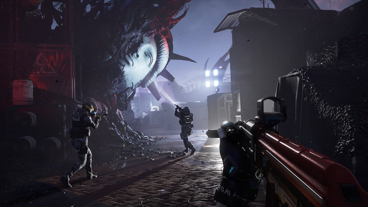 A promo image of Rainbow Six Extraction shows the destroyed head of the Statue of Liberty half-covered in black alien biomatter.