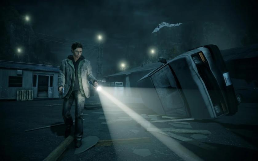Alan Wake holds a flashlight in the first game of the franchise.