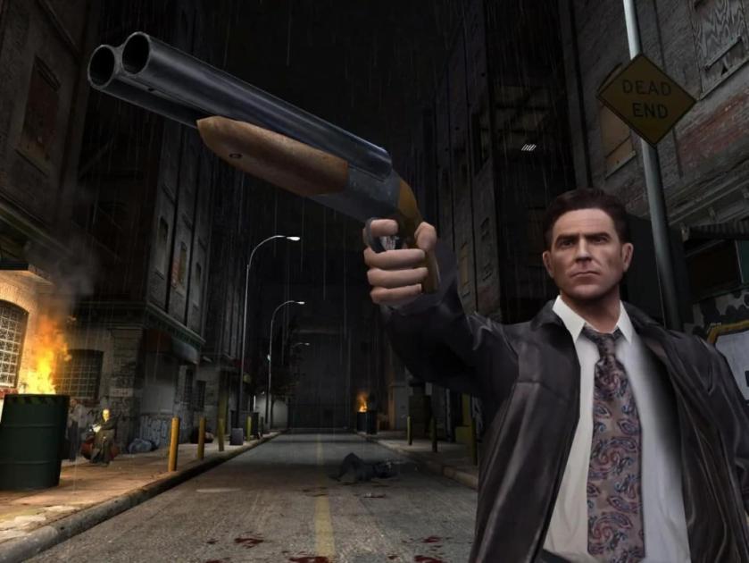 Max Payne holds a shotgun in promo art for Max Payne 2.