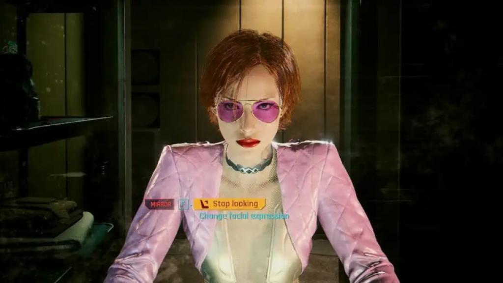 Female V looking in the mirror in Cyberpunk 2077.