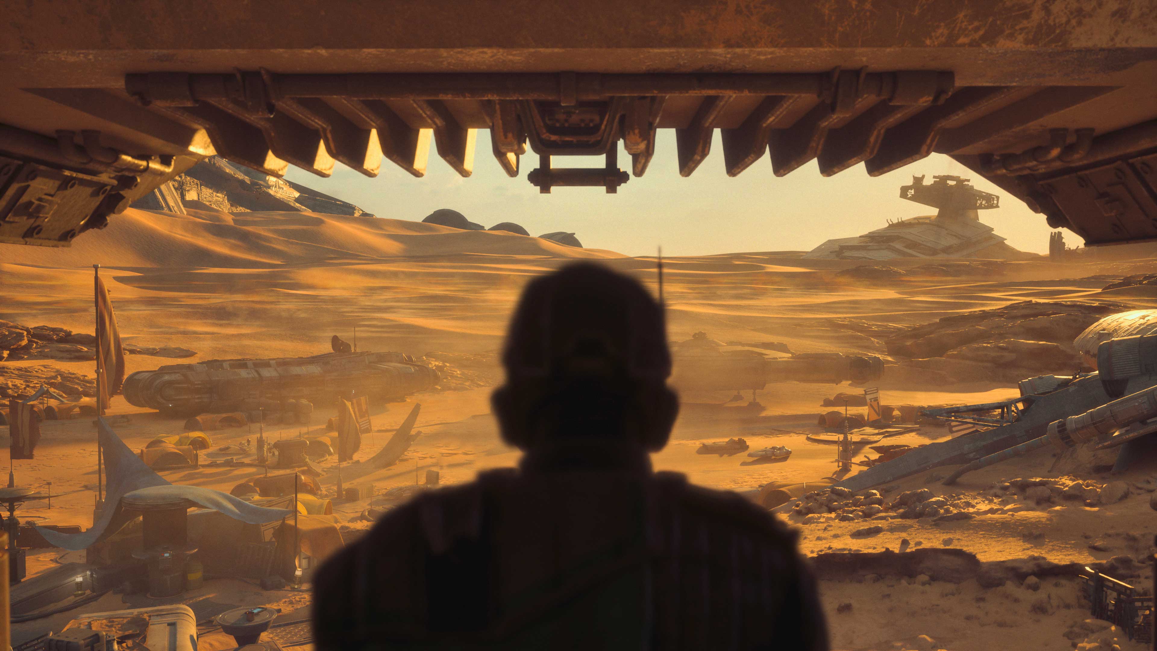 A silhouetted person looking over Jakku's racetrack